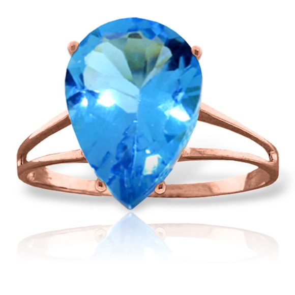 14K. SOLID GOLD RING WITH NATURAL BLUE TOPAZ